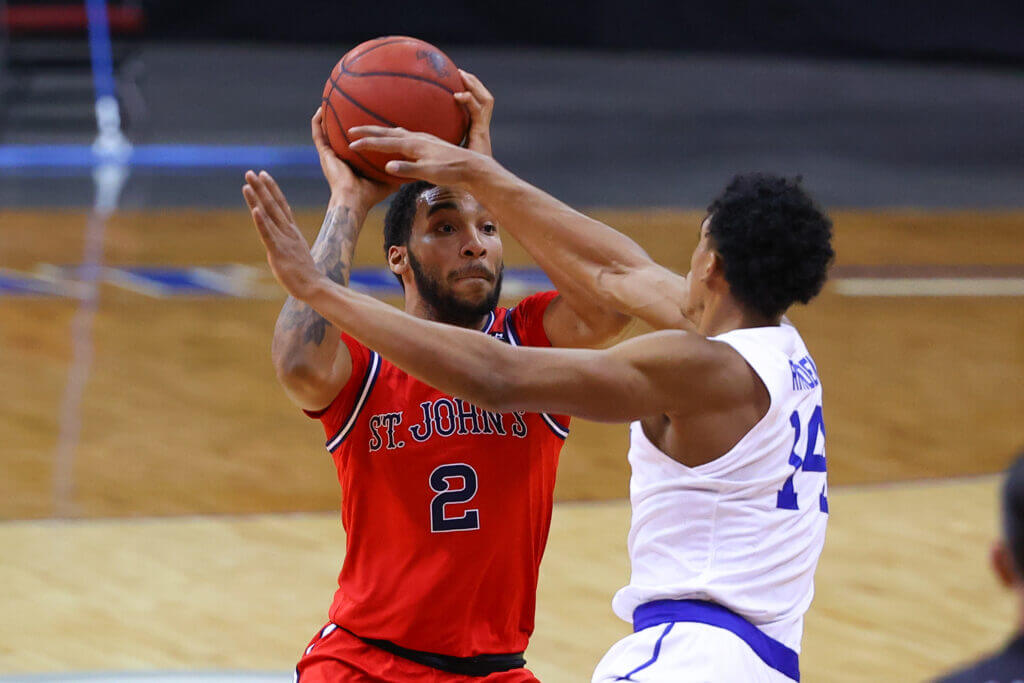 NEWARK, NJ - DECEMBER 11:  St. John's Red Storm guard Julian Champagnie (2) controls the ball during the college basketball game between the Seton Hall Pirates and the St. John's Red Storm on December 11, 2020 at the Prudential Center in Newark, NJ.  (Photo by Rich Graessle/Icon Sportswire via Getty Images)